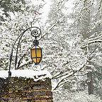 Exterior winter shot of campus with snow on the wall.