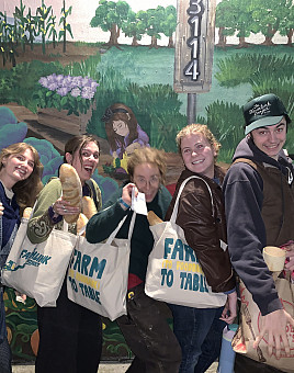 Director Aidan O'Connor (far right), Beau Staun-List (far left), and other Nutrition INSIDE team members work hard to reroute surplus foo...