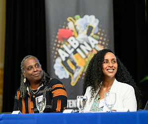 President Robin Holmes-Sullivan (left) and AVT Executive Director Winta Yohannes at an Albina Vision Trust partnership event at Lewis 