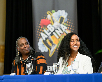 President Robin Holmes-Sullivan (left) and AVT Executive Director Winta Yohannes at an Albina Vision Trust partnership event at Lewis 