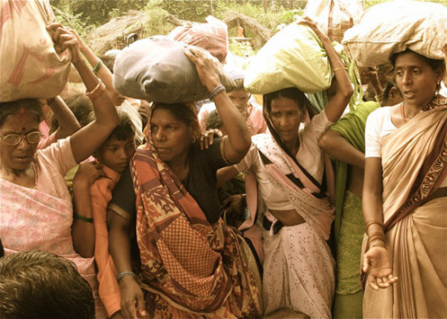 Women at food distribution in flooded area, Vrinavan