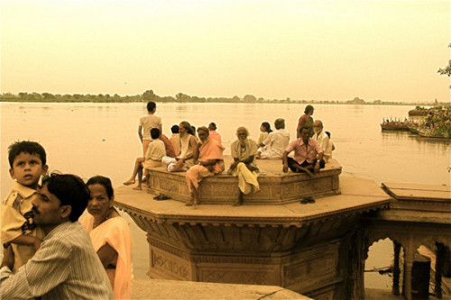 Observers of the rising Yamuna River at Keshi Ghat, Vrindavan