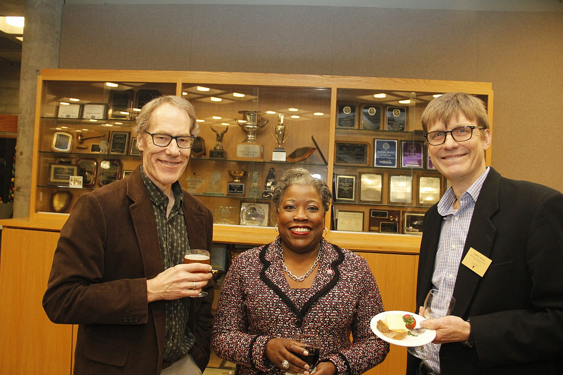 Marcilynn Burke with Environmental faculty members, Dan Rohlf and Chris Wold.