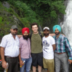 Victor Reuther (middle) with new friends at Bhagsu Falls, India