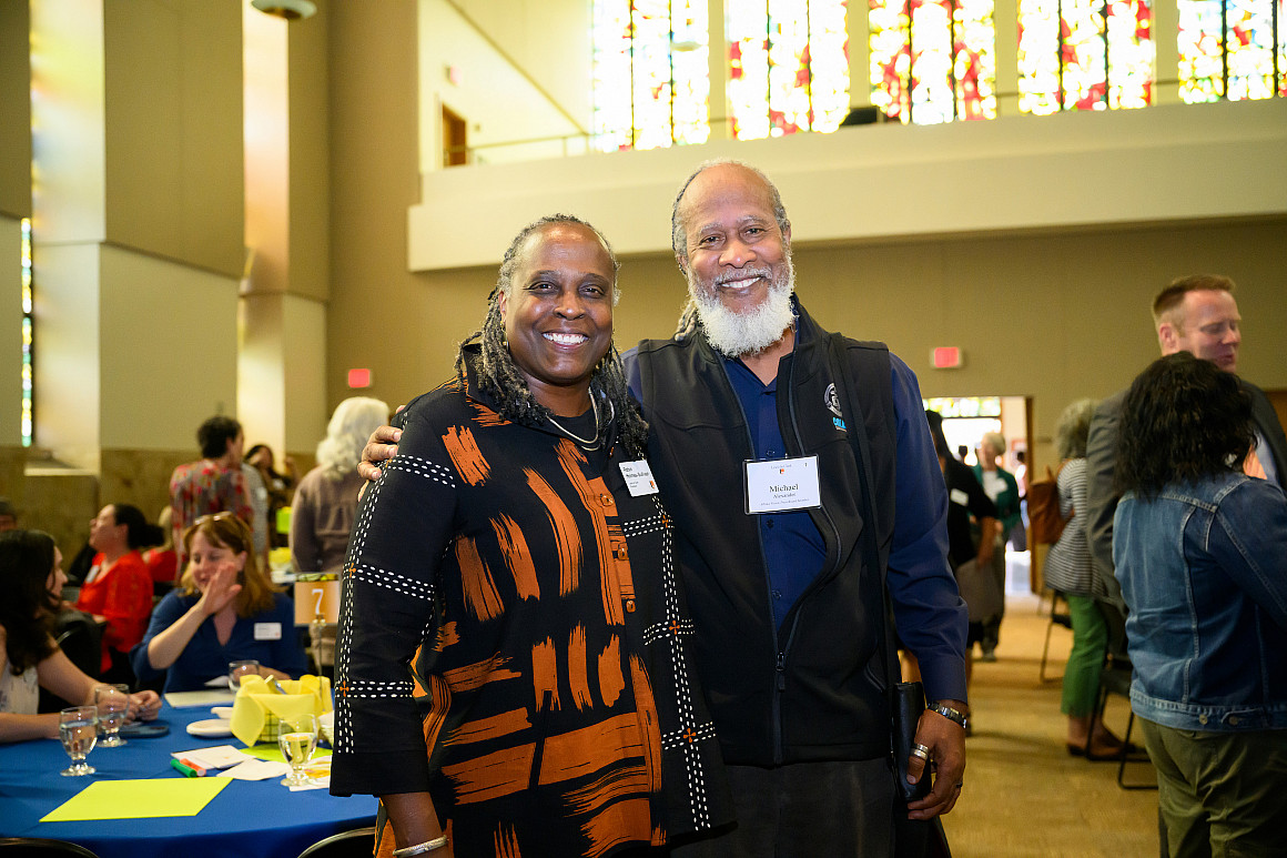 President Robin Holmes-Sullivan with Albina Vision Trust Board Member Michael Alexander.