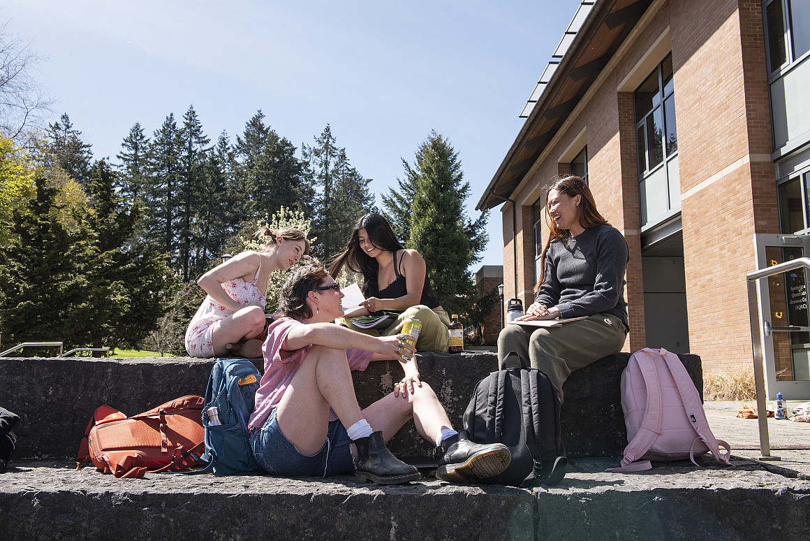 Students lounge in the sun.
