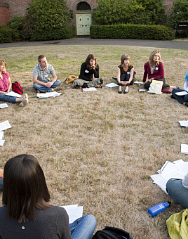 Graduate students gather outside for group activities.